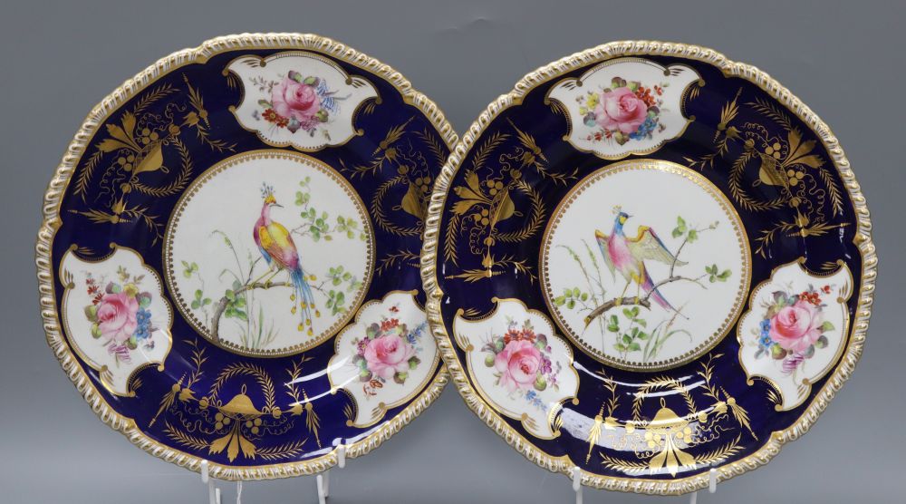 A pair of Royal Crown Derby plates, gilt decorated with birds and flowers, diameter 26cm